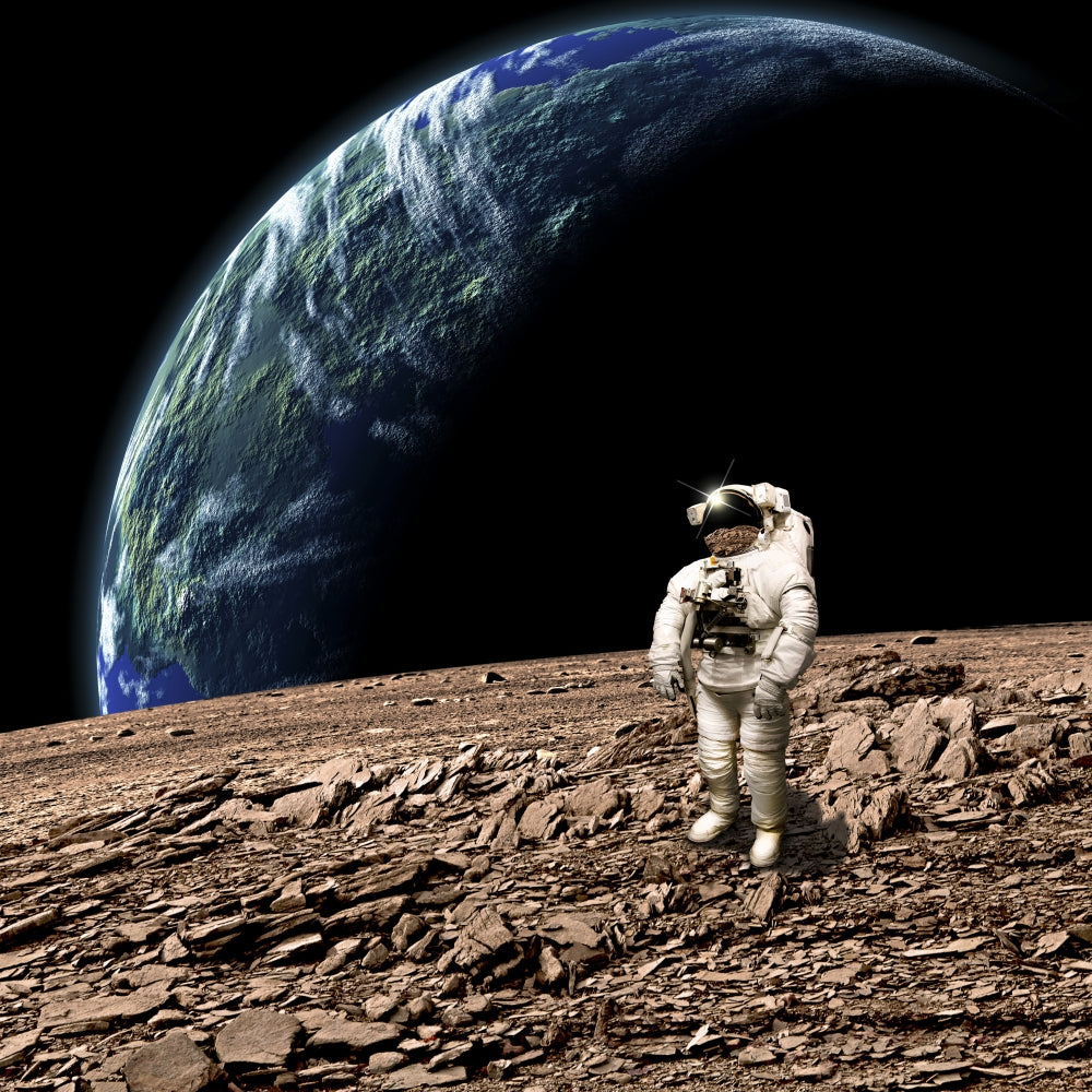 Astronaut on a barren planet poster print featuring an Earth-like planet in the background.