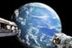 Astronauts working on a space station above an alien ocean planet poster print.