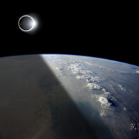 Solar Eclipse Poster Print showing the Earth partially shaded by the eclipse.