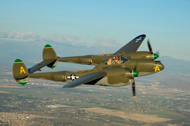 P-38 Lightning flying over Chino, California poster print by Phil Wallick.