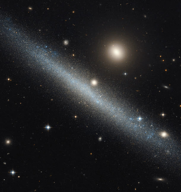 Dwarf Galaxy UGC 1281 Poster Print by Roberto Colombari in Triangulum Constellation