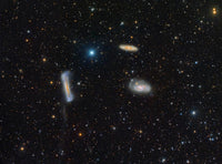 The Leo Triplet Poster Print showcasing three galaxies in vibrant colors.