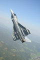 Austrian Air Force EF2000 Typhoon over the Austrian Alps Poster Print by Riccardo Niccoli