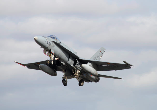 Spanish Air Force EF-18M Hornet taking off Poster Print by Riccardo Niccoli