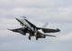 Spanish Air Force EF-18M Hornet taking off Poster Print by Riccardo Niccoli