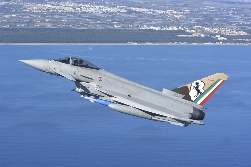Italian Air Force Eurofighter F-2000 armed with bombs and targeting pod poster print.