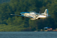 P-51 Mustang flying over the Mississippi River at Dubuque, Iowa