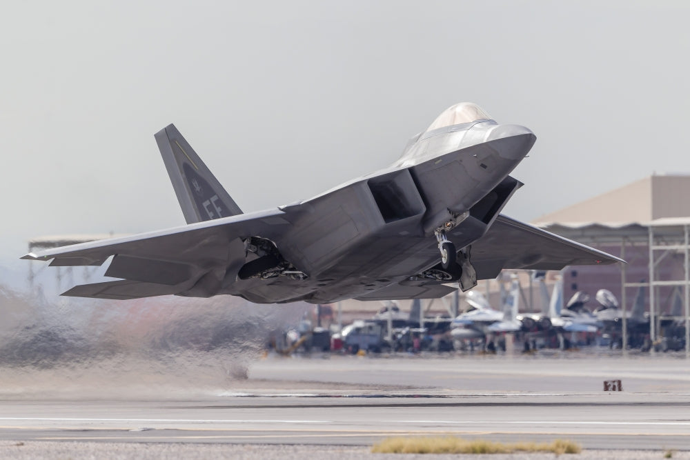 F-22 Raptor launching from Nellis Air Force Base poster print.