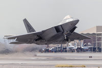 F-22 Raptor launching from Nellis Air Force Base poster print.