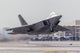 F-22 Raptor launching from Nellis Air Force Base poster print.