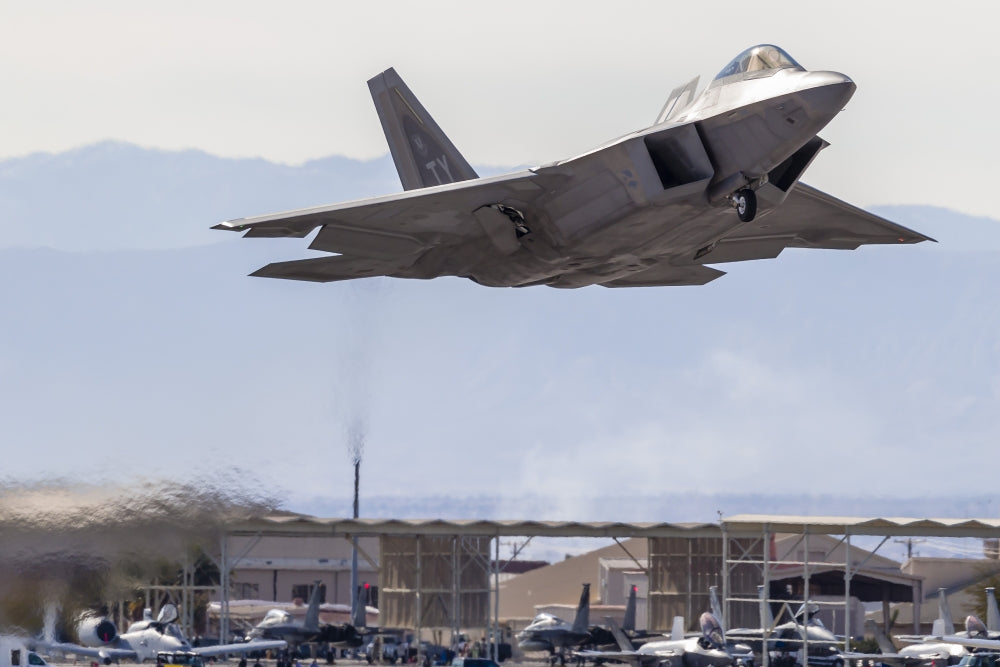 U.S. Air Force F-22A Raptor taking off from Nellis Air Force Base poster print by Rob Edgcumbe.