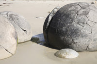 Moeraki Boulders poster print showcasing spherical septarian concretions on Koekohe Beach, New Zealand.