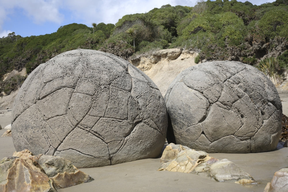 Moeraki Boulders Poster Print showcasing unique spherical septarian concretions in New Zealand.