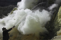 Miner cooling condensation pipes at Kawah Ijen volcano in Java, Indonesia poster print.