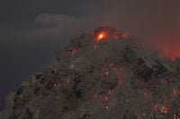 Glowing summit of Rerombola lava dome during 2012 eruption, Paluweh volcano, Flores, Indonesia poster print.