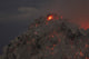 Glowing summit of Rerombola lava dome during 2012 eruption, Paluweh volcano, Flores, Indonesia poster print.