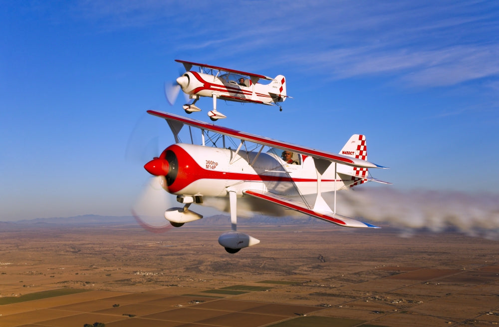 Poster print of Two Pitts Model 12 aircraft flying over Chandler, Arizona