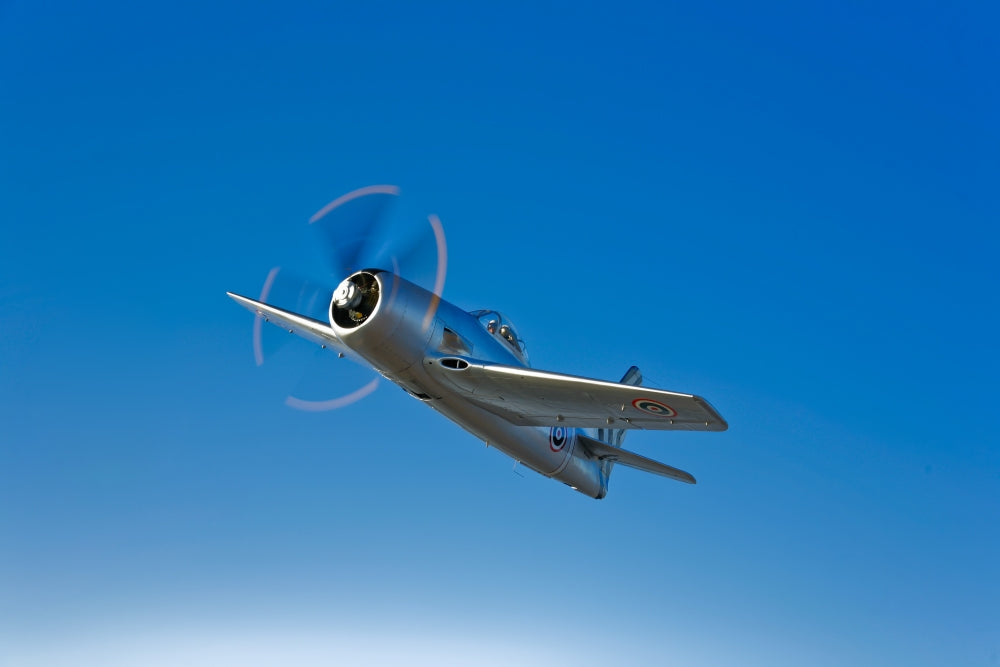Grumman F8F Bearcat in flight near Chino, California poster print.