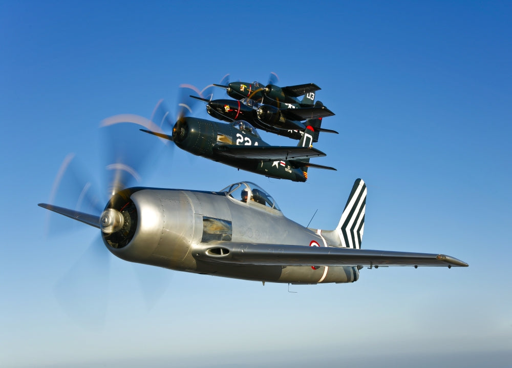 Grumman F8F Bearcats and F7F Tigercats flying in formation