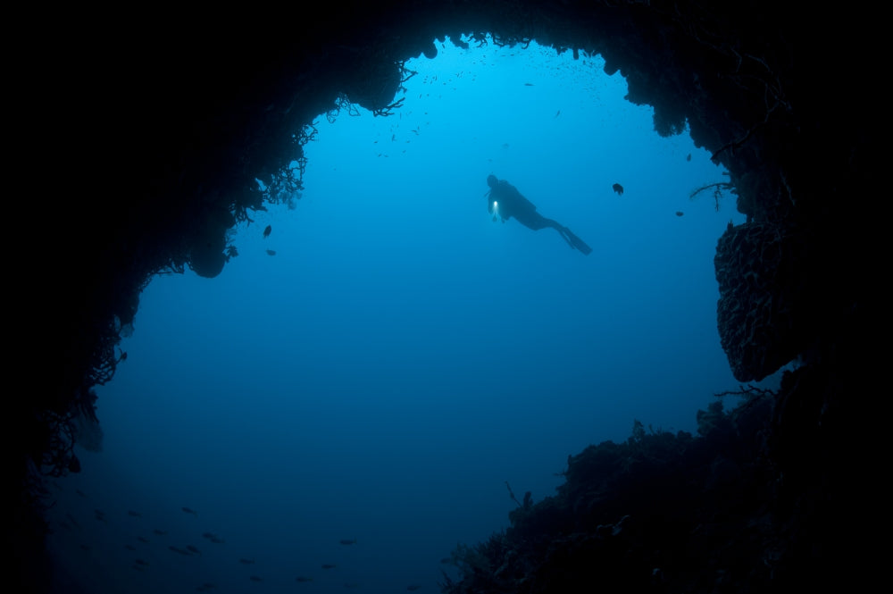 Diver Exploring a Cavern in Gorontalo, Sulawesi, Indonesia Poster Print