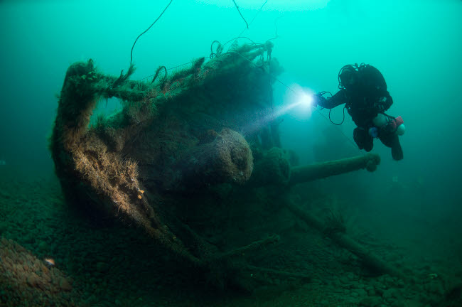 Diver exploring the wreck of the SS Laurentic ocean liner, underwater art print