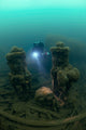 Diver exploring the wreck of the SS Laurentic ocean liner underwater poster print.