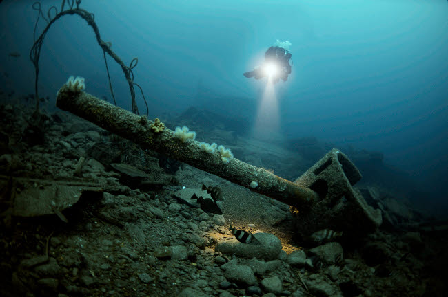 Diver exploring the HMS Audacious shipwreck poster print by Steve Jones, underwater photography, marine exploration.