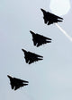 Four F-14D Tomcats in flight poster print showcasing military aircraft in action.