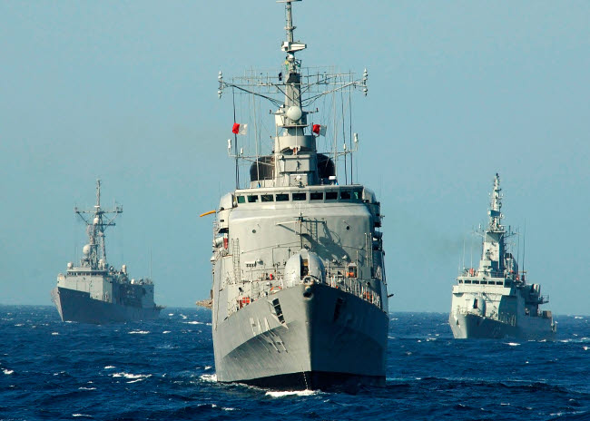 Naval forces performing tactical maneuvers off the coast of Brazil poster print.