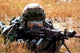 An Airman Takes Up a Firing Position Poster Print showcasing military dedication.