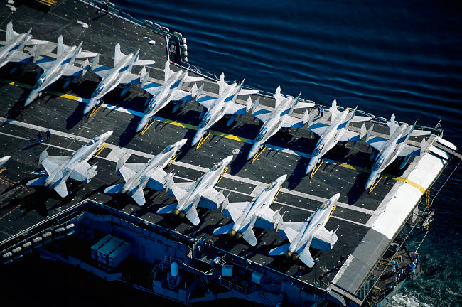 Jets on Aircraft Carrier Poster Print showcasing military jets in action.