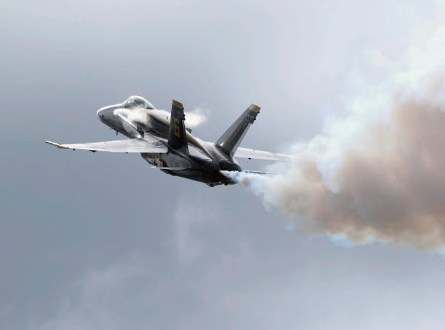 Blue Angels lead pilot performing a high alpha maneuver at an air show poster print.