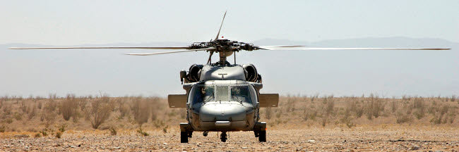 MH-60S Seahawk poster print showcasing a helicopter idling in a landing area.