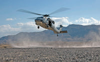 MH-60S Seahawk helicopter practicing landings in the desert poster print.