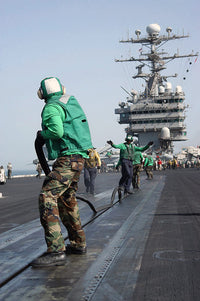USS George Washington Catapult Crew Poster Print by Stocktrek Images