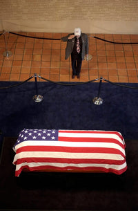 A mourner pays respects to Ronald Reagan poster print.