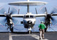 E-2C Hawkeye flying over USS Abraham Lincoln aircraft carrier poster print.