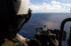 Aviation Warfare Systems Operator firing a 50 caliber machine gun poster print
