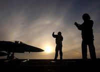 Sailors giving taxi signals to an F/A-18 Hornet Poster Print