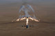 Aerial shot of a KC-130 Stratotanker firing flares over Iraq.