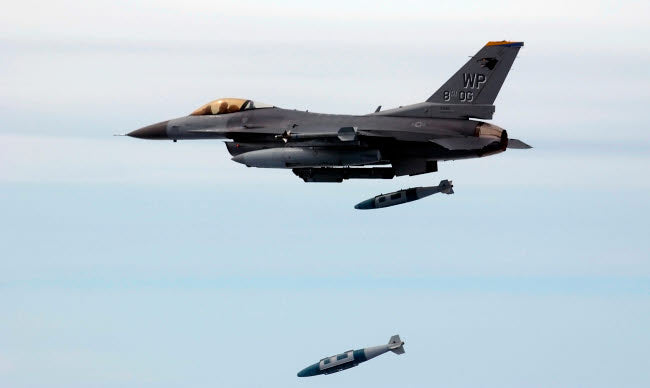 F-16 Fighting Falcon poster print showcasing aerial combat action.