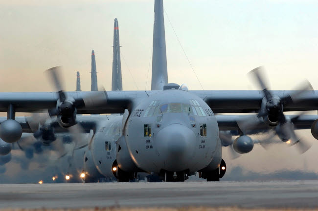 C-130 Hercules aircraft taxiing for mission poster print