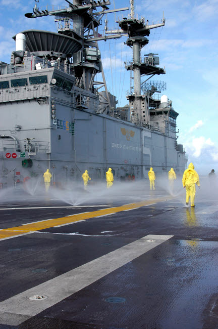 Personnel testing Aqueous Film Forming Foam on USS Bataan poster print