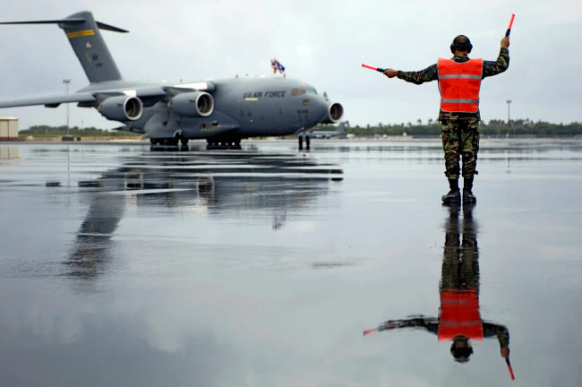 Master Sergeant signals in a C-17 Globemaster III poster print, showcasing military aviation.