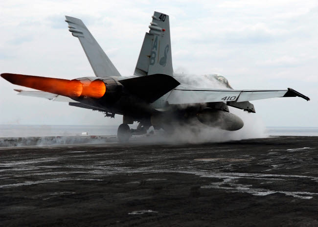 F/A-18C Hornet launching from USS Enterprise on flight deck