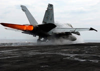 F/A-18C Hornet launching from USS Enterprise on flight deck