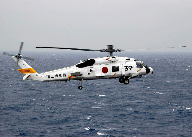 Japan Maritime Self Defense Force H-60 helicopter in flight poster print.
