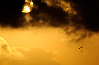Parachute jumper descending during a training mission poster print.