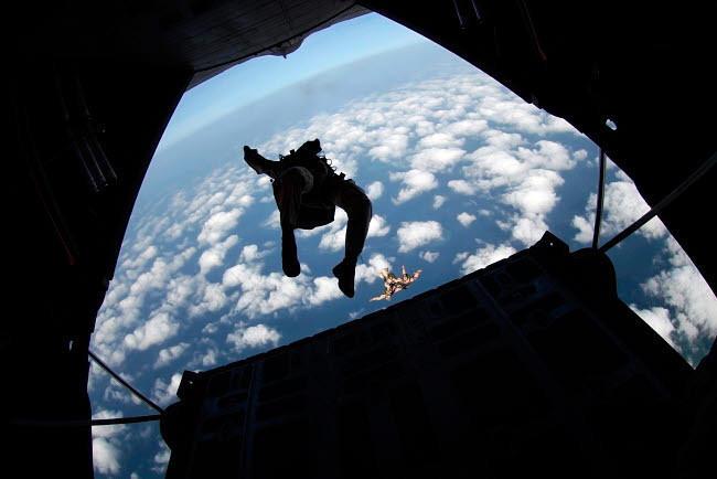 Air Force C-130 Hercules Jump Practice Poster Print featuring military members in action.