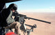 US Marine with GAU-16/A Cal 50 machine gun on UH-1N Huey helicopter poster print.